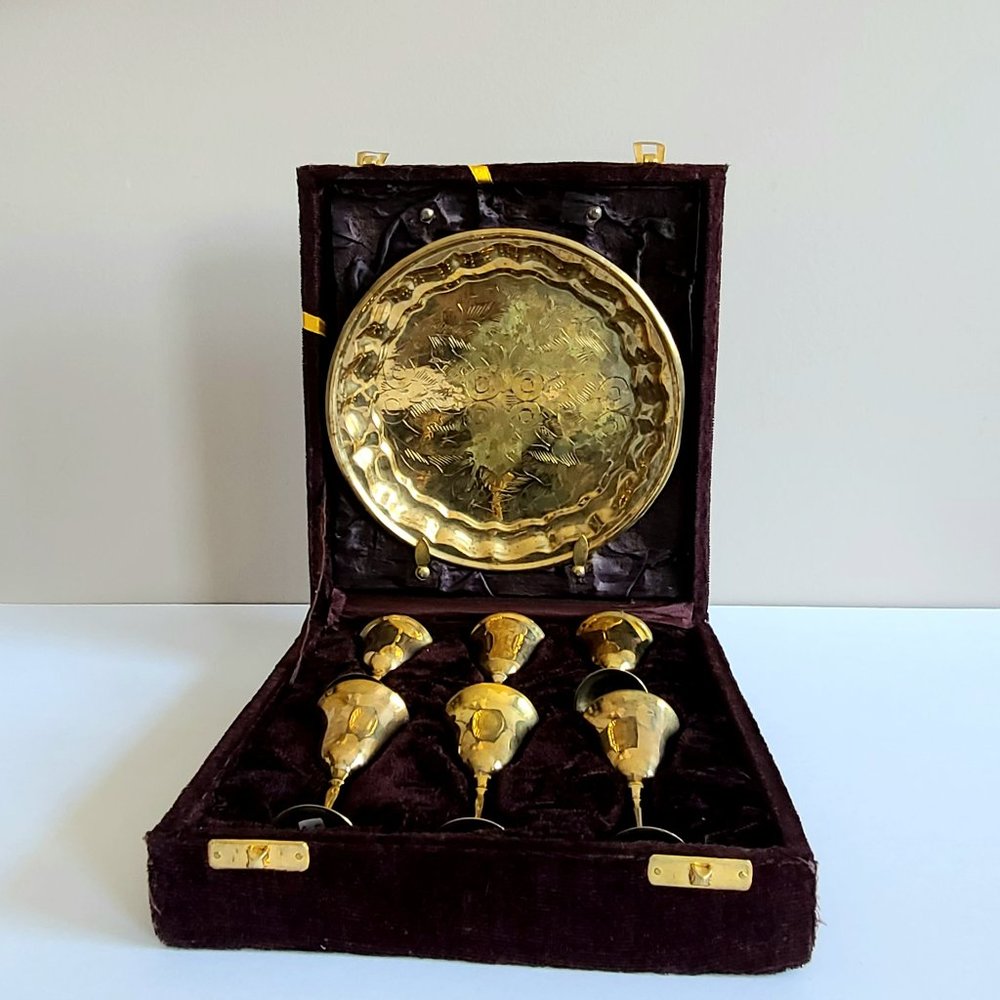 Set of 6 vintage brass goblets with tray in purple velvet box.